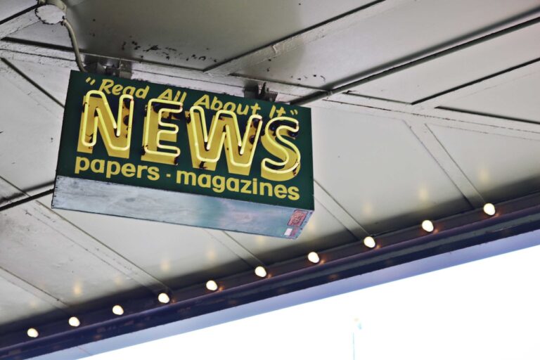 Stock photo of news signs outside convenience store