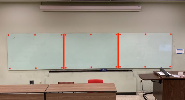 Photo of a three whiteboards in a classroom