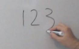 Screenshot of a hand writing 123 on a whiteboard