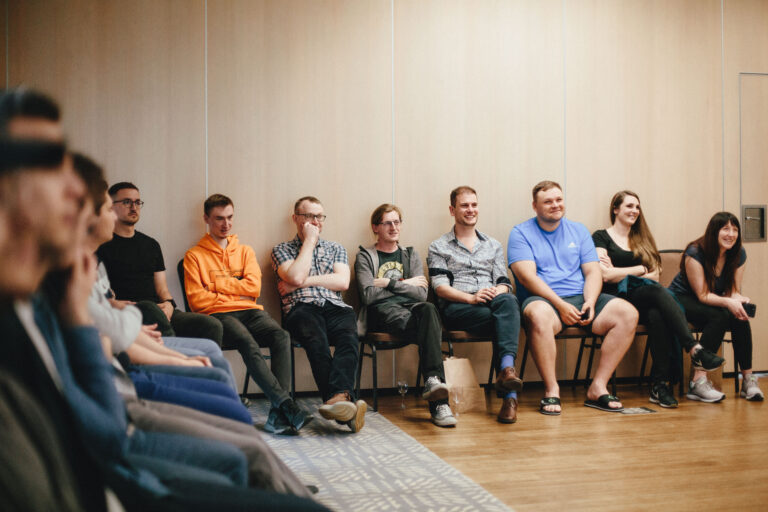 Frompolandwithdev employees watching the presentation of the Sharetheboard application