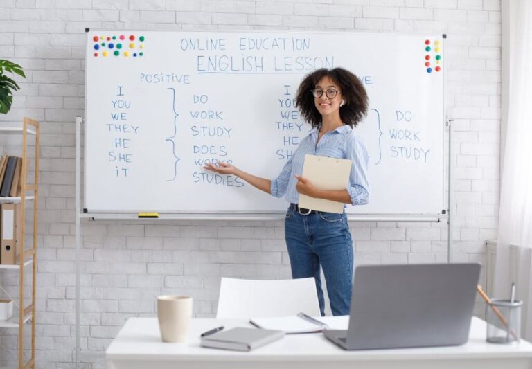 Stock image with teacher in front of desk